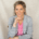 Danielle de Wilde – talentcoach en trainer bij Voldaan – lacht zelfverzekerd in de camera, symbool voor zichtbaarheid en persoonlijk leiderschap.